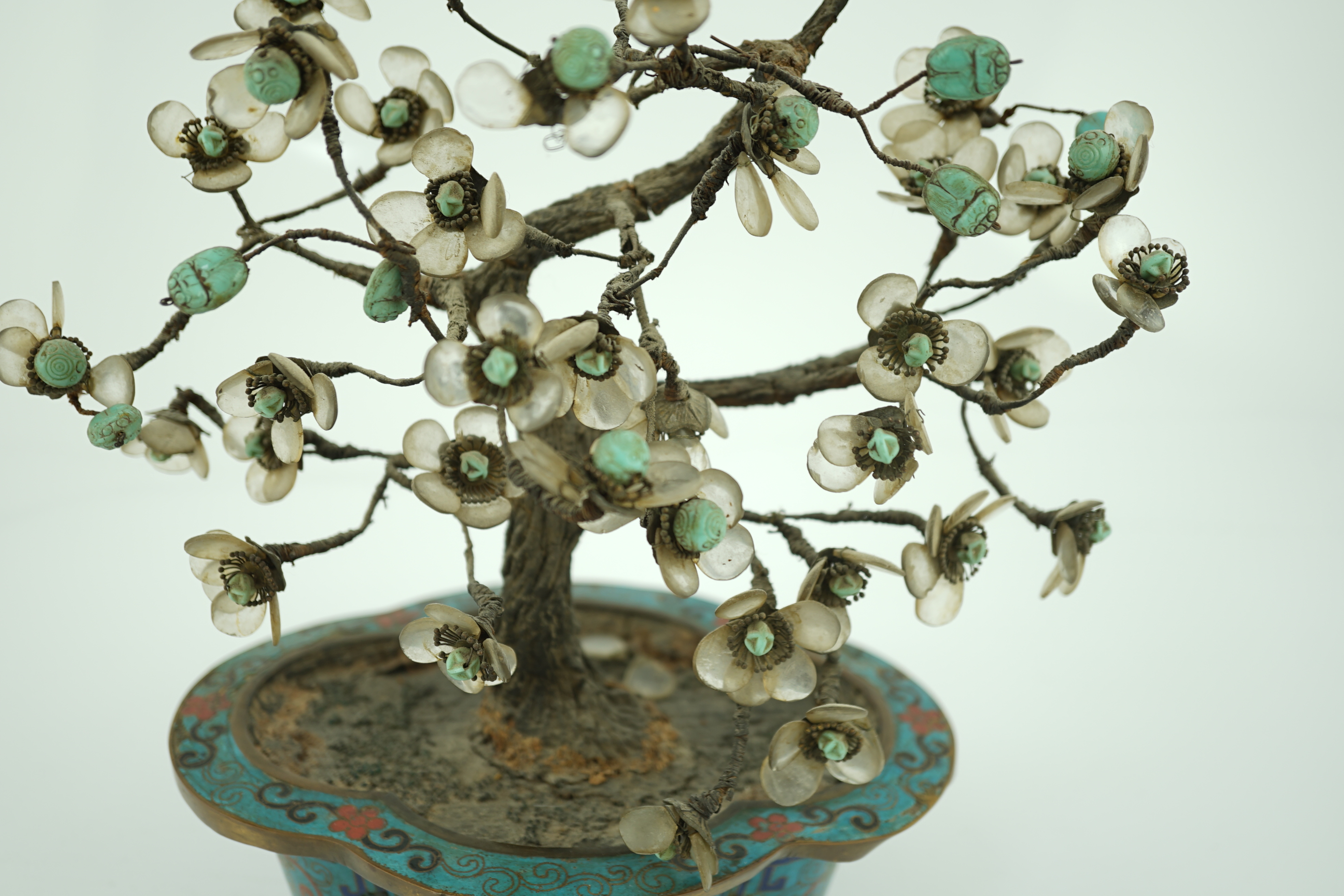 A Chinese cloisonné enamel jardiniere housing a glass mounted model tree, 19th century